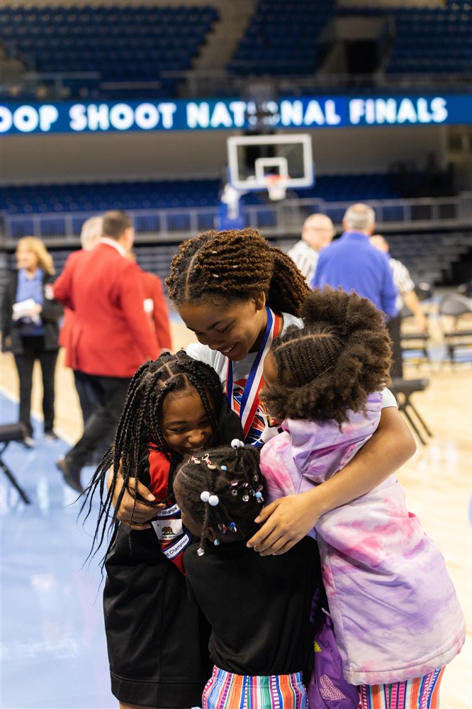 Kyla and Kira hugged at the 2022 National Finals after Kyla became a National Champion.